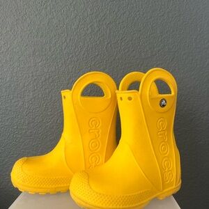 Cute yellow crocs for a toddler boy or girl.